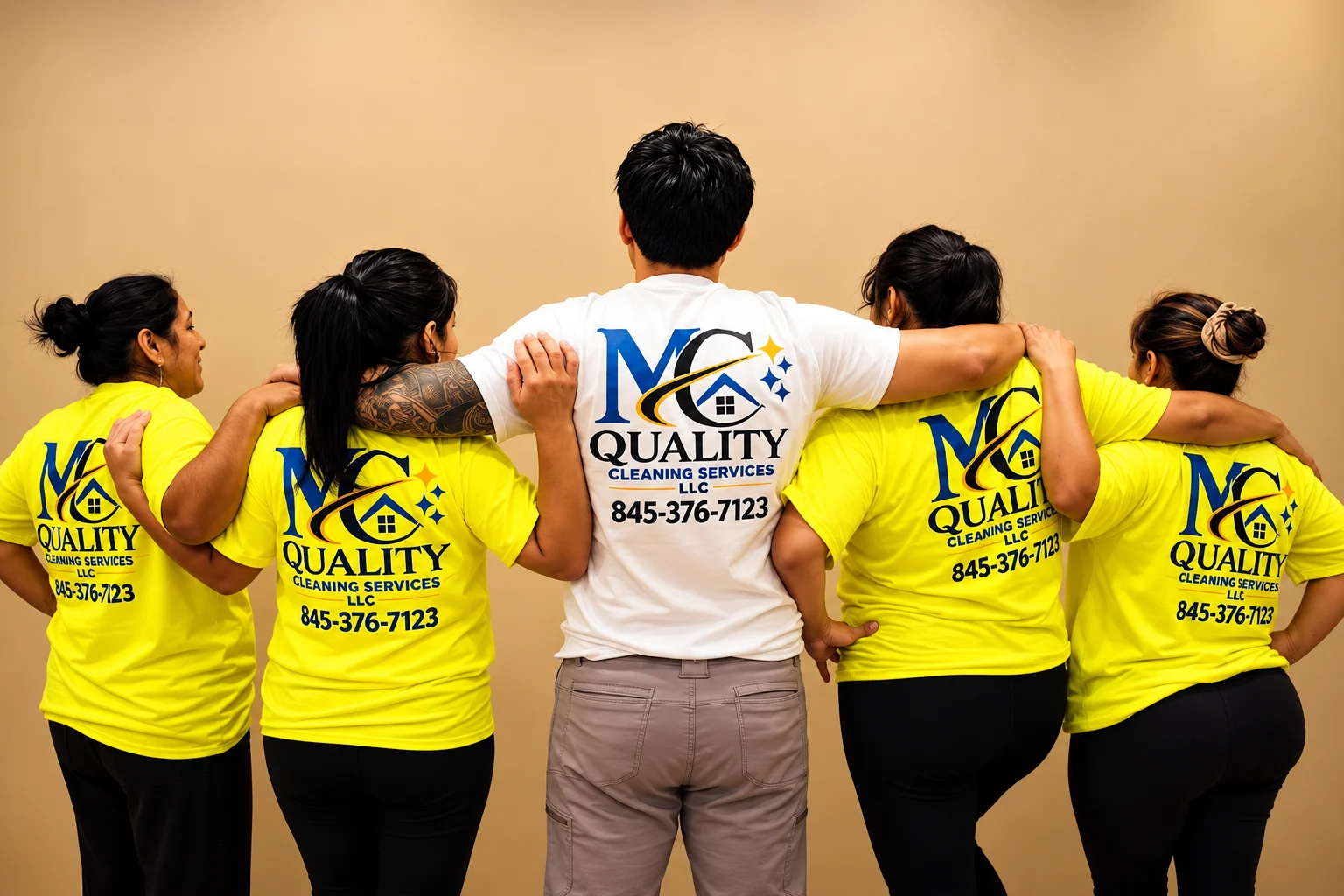 MC Quality team together in branded shirts